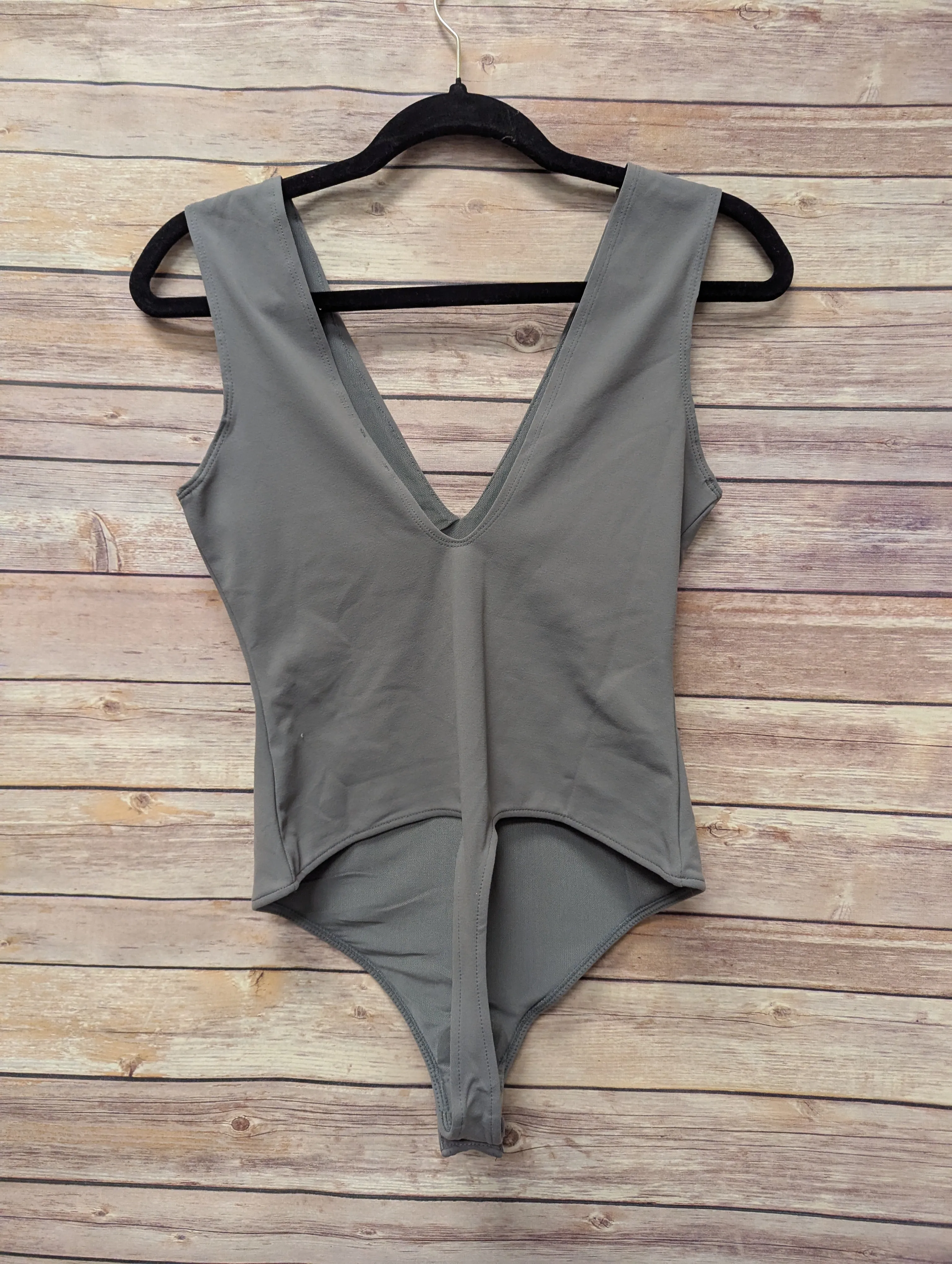 NWTs, Grey free people bodysuit. Size M. 97